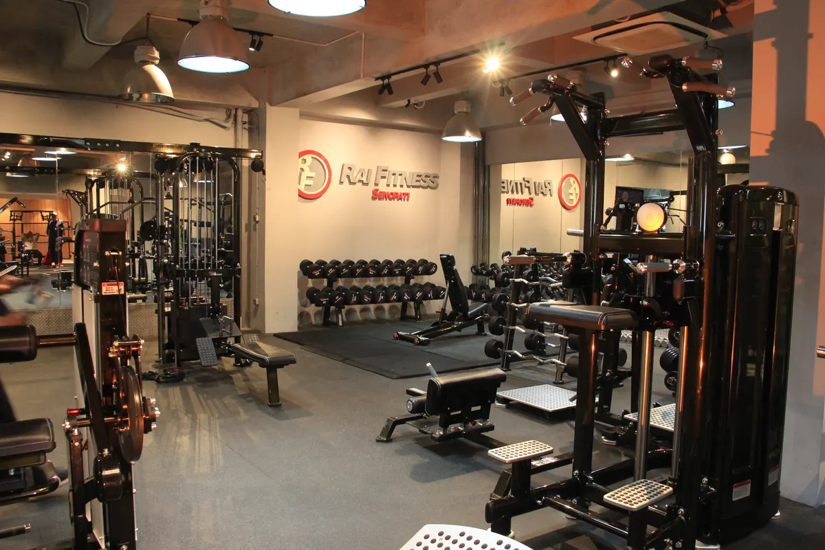 Gym owner reviewing financial break-even calculations for a commercial fitness facility
